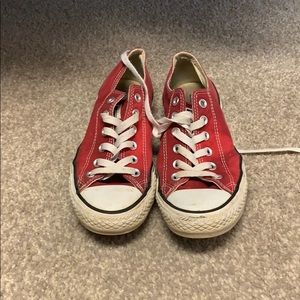 Worn red low top converse